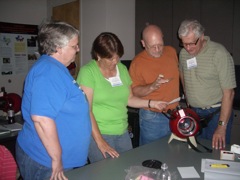 Sherre, Debra Evans, Mike Furrey, and Larry examine the Astroscan.