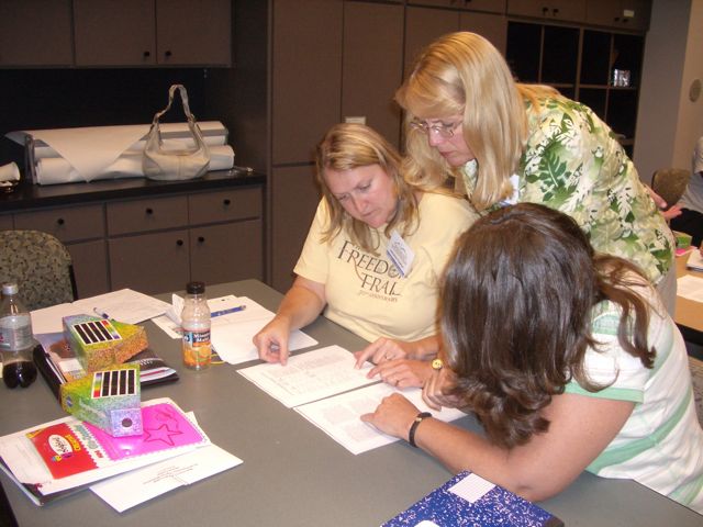 Janene, Nikki, and Jinx compare telescopes and instruments