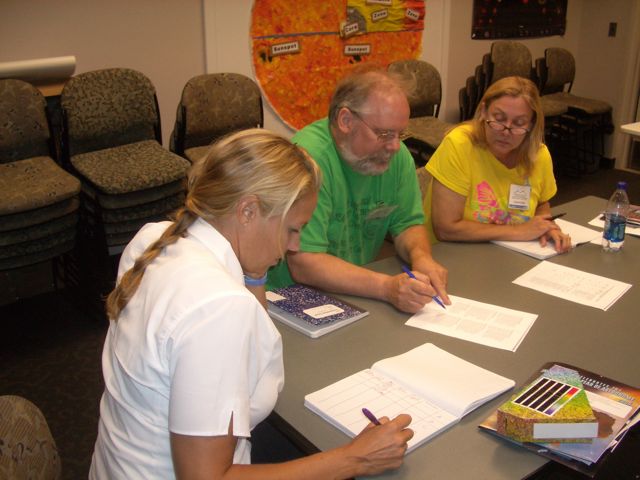 Leslie, David, and Laura make careful notes