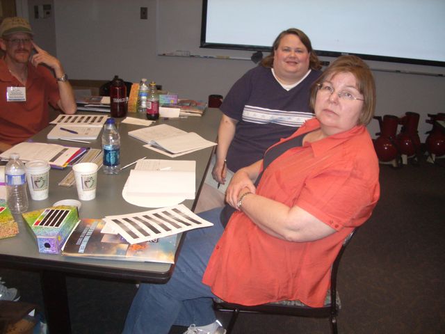 Kathryn and Bronwyn listen intently