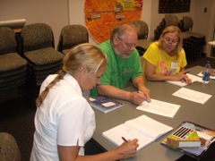 Leslie, David, and Laura make careful notes