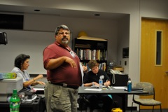 Peter Guastella leads the activity.