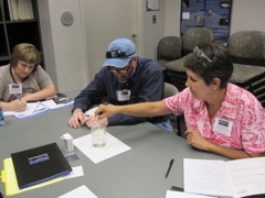 Deirdra Dufault, Steve Biles, and Terri Large model accretion with pepper in water.