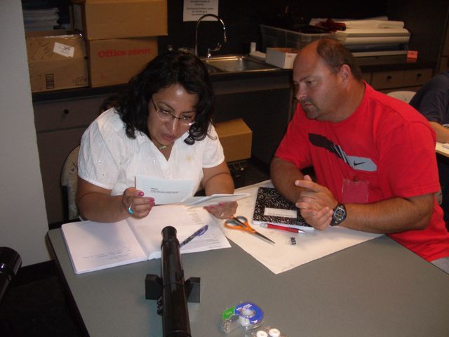 Colleen Ruiz and Kyle examine the cards carefully