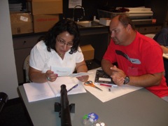Colleen Ruiz and Kyle examine the cards carefully